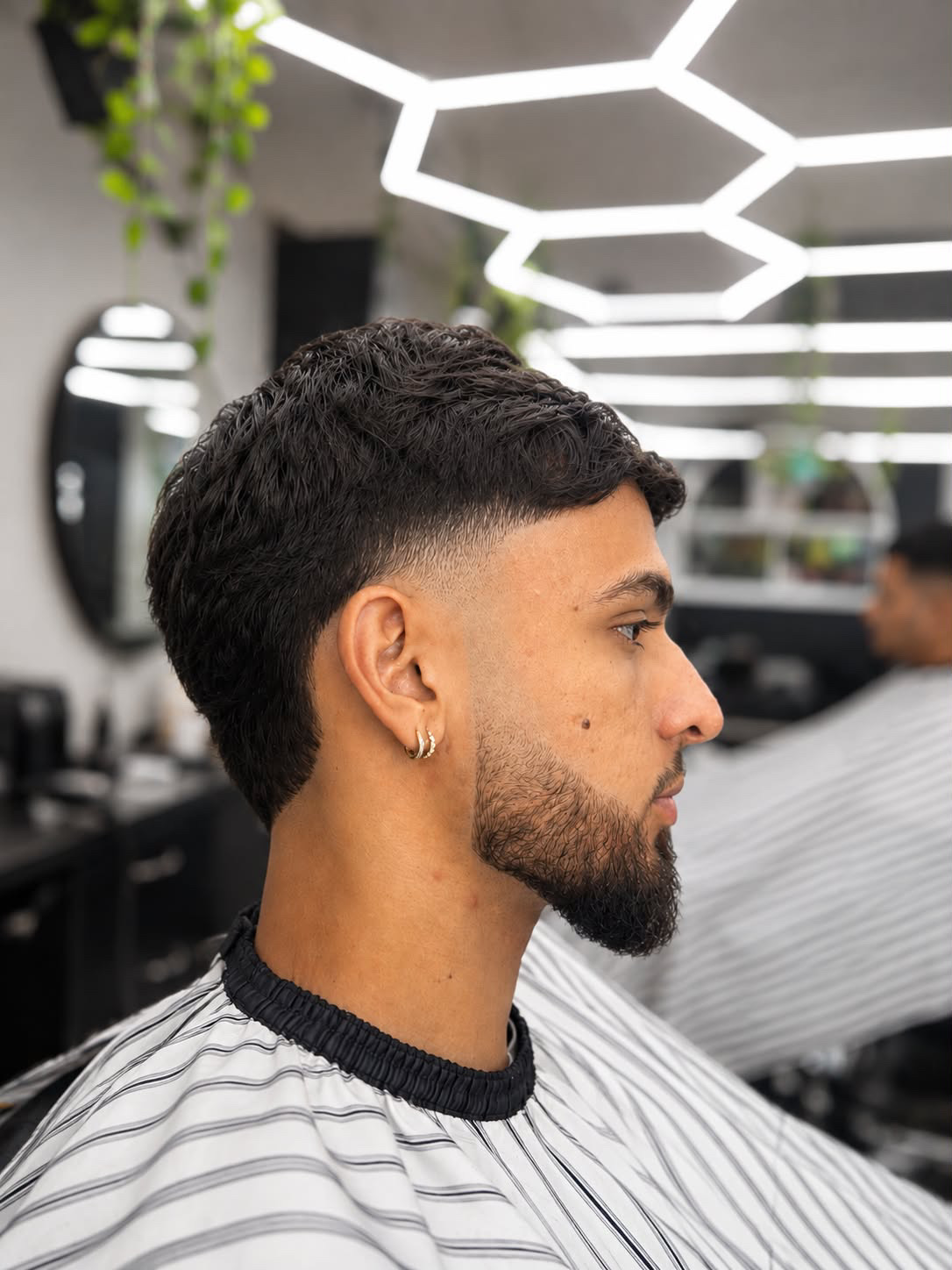 Wavy textured crop with a low fade at Kritikos Barbershop