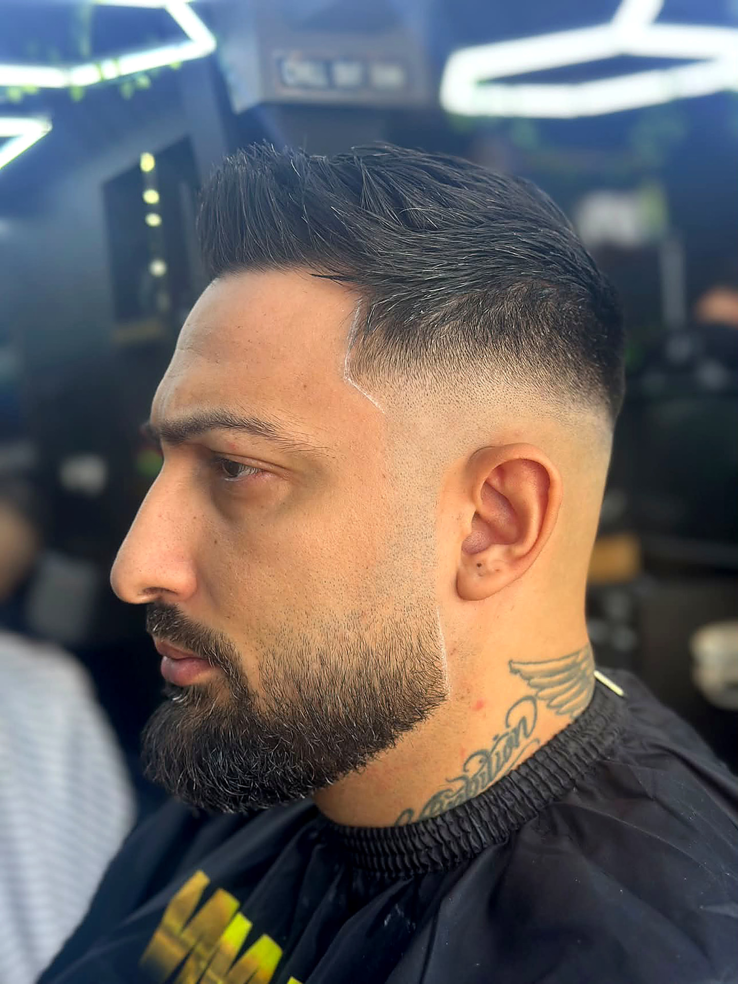 Sharp skin fade haircut by Kritikos Barbershop