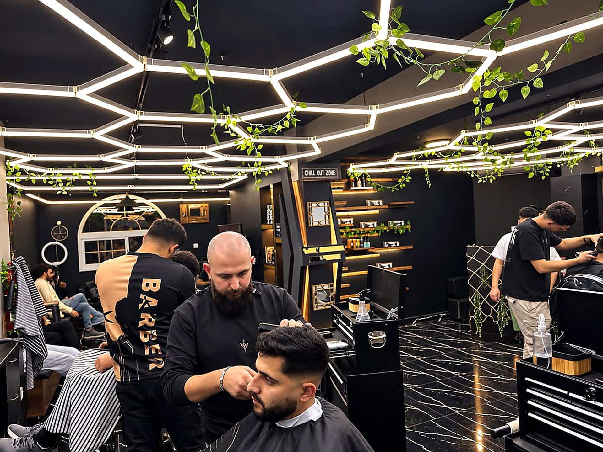 Inside Kritikos Barbershop — chairs, lights and work in progress